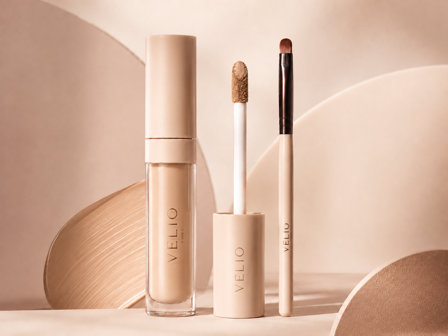 Unbranded VELIO-style precision concealer visual with concealer wand and detail brush.